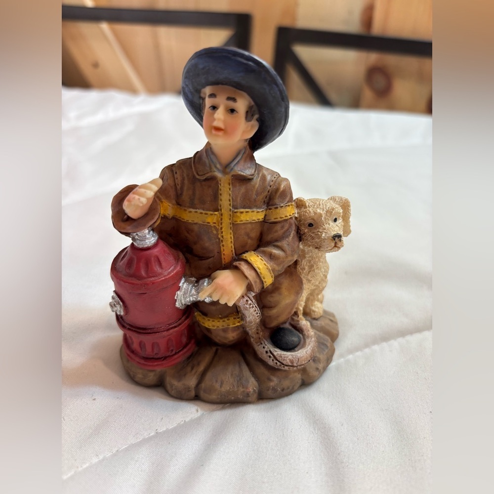 Firefighter Figurine with Dog - connecting hose to fire hydrant. Decor fireman